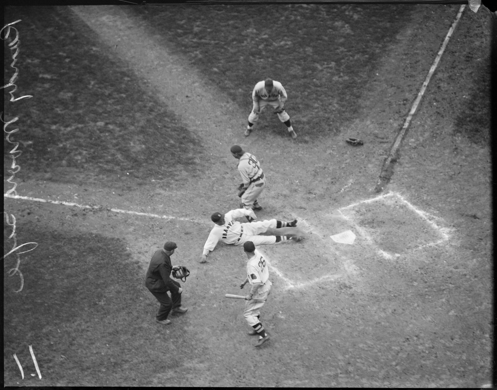Randy Moore of the Braves is safe at home