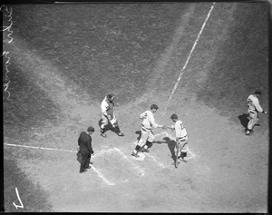 Pittsburgh Pirates Gus Suhr scores against the Boston Braves.