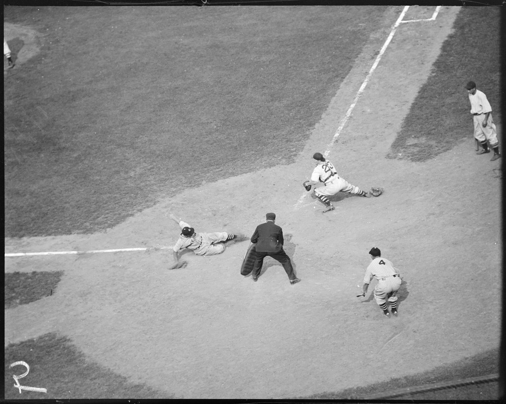 Cleveland player slides in ahead of the tag, Fenway Park