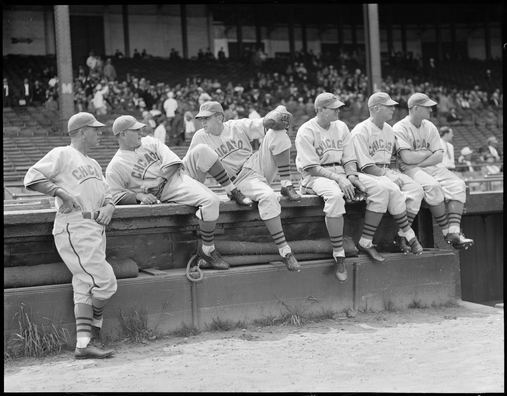 Chicago players sitting on the edge of the field