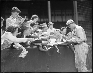 Dizzy Dean, St. Louis pitcher, signing autographs at Braves field
