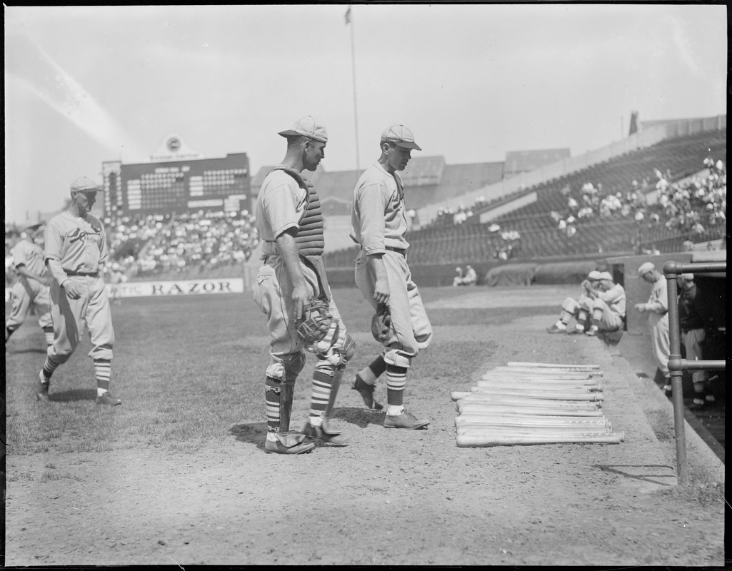 Dizzy Dean of the Cardinals walks to the dugout with his catcher, Braves field