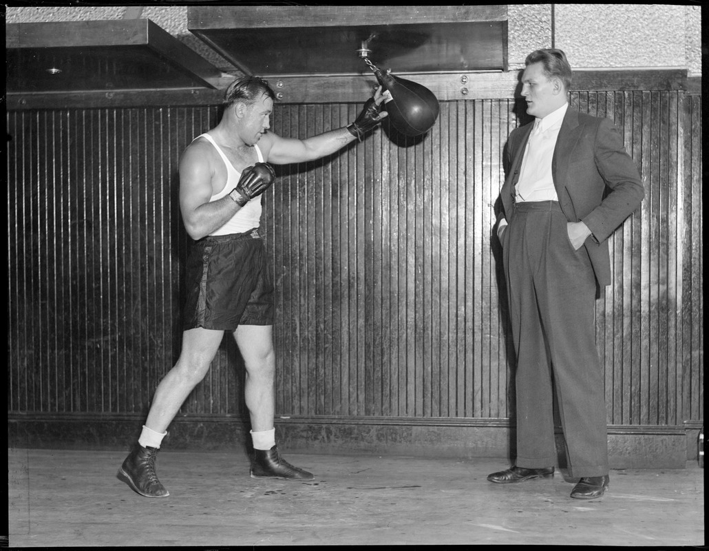 Jack Sharkey works the speed bag as Ernie Schaaf looks on