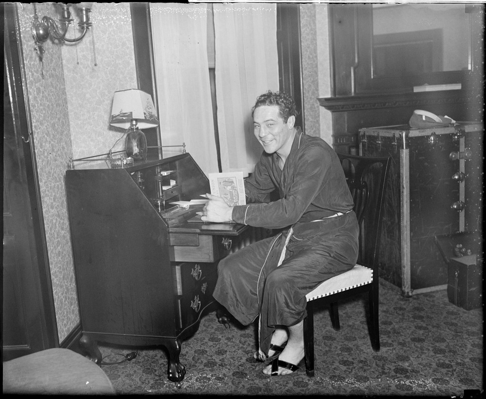 Max Baer at his desk in room at the Hotel Touraine