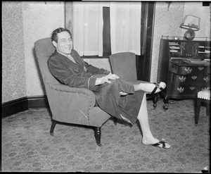Max Baer relaxing in room at Hotel Touraine