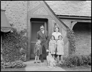 Jack Sharkey and family in front of home after return from New York and defeating Max Schmeling for world championship