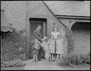 Jack Sharkey and family in front of home
