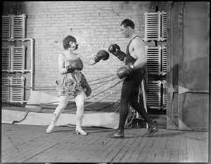 Jack Dempsey spars with pretty actress