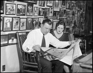 Jack Sharkey and wife reading the paper at their Chestnut hill home
