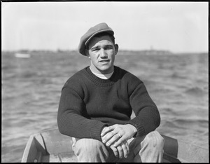 Welterweight champ Lew Brouillard sitting in boat