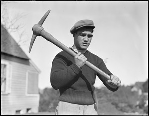 Lew Brouillard, welterweight champ, shows he's handy with a pickaxe too
