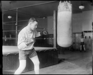 Jim Maloney, local boxer, working the heavy bag
