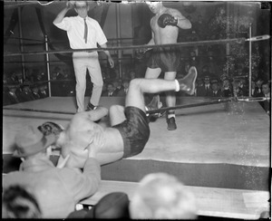 Boxer knocked through the ropes