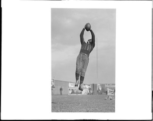 Haskell Indians left end Norton catching forward pass
