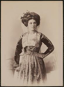 Studio portrait of woman in traditional Greek dress