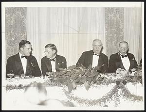 Present at the President's Dinner of the Clover Club of Boston, held last night at the Hotel Somerset. Left to right: Paul G. Kirk, state commissioner of public safety; James Bryant Conant, president of Harvard University; Leo H. Leary, retiring president of the Clover Club; and Mayor Frederick W. Mansfield.