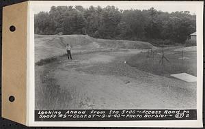 Contract No. 67, Improvement and Surfacing Access Road to Shaft 9, Quabbin Aqueduct, Barre, looking ahead from Sta. 3+00, Barre, Mass., Sep. 4, 1940