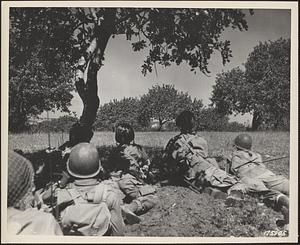 U.S. paratroopers advancing through the Sicilian countryside after night landing