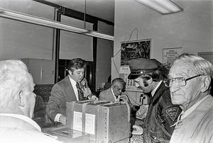 Assistant City Clerk Frank Kowalski, Harry Toltz and Officer Robitaille and unidentified man, city clerk's office