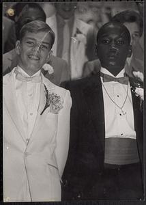 Brian Gomes and Richard "Mokey" Harding posing in tuxedos