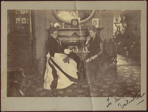 Gertrude Stevens playing chess with unidentified woman in drawing room