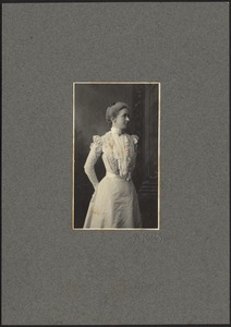 Harriet Armington Brown Day in light dress with high collar