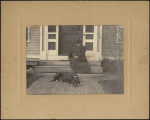 Woman sitting on porch with black Scottish Terrier and Great Dane, "Etzel"