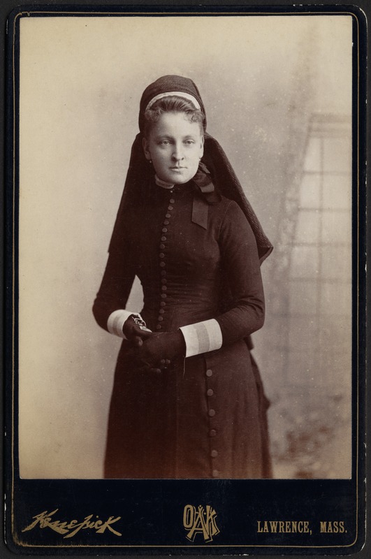 Young woman in black dress and headdress, possibly a nurse uniform Unidentified, same woman in photo W 146