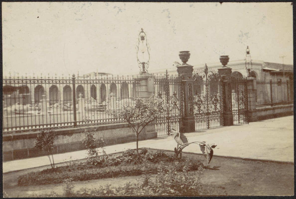 Ornate gate entrance to formal building (embassy?) - Digital Commonwealth