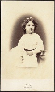 Young girl, dark hair, white bow and frock