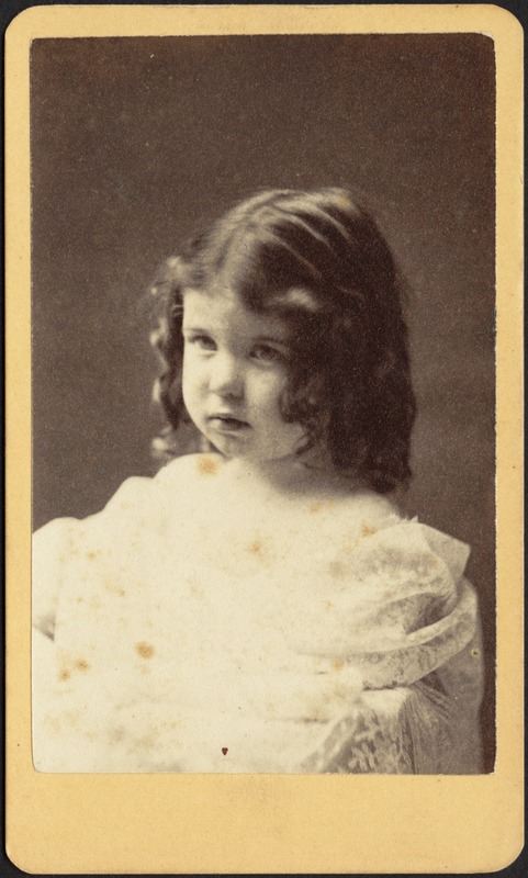 Young girl with dark hair, shoulder-length ringlets, white frock