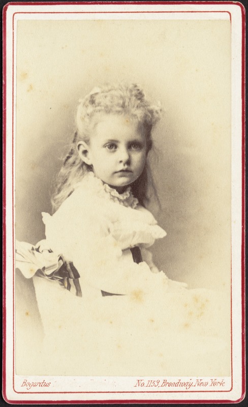 Young girl with long blond hair and white frock