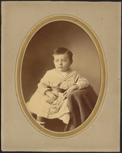 Studio portrait of a young boy, seated, possibly Berry family