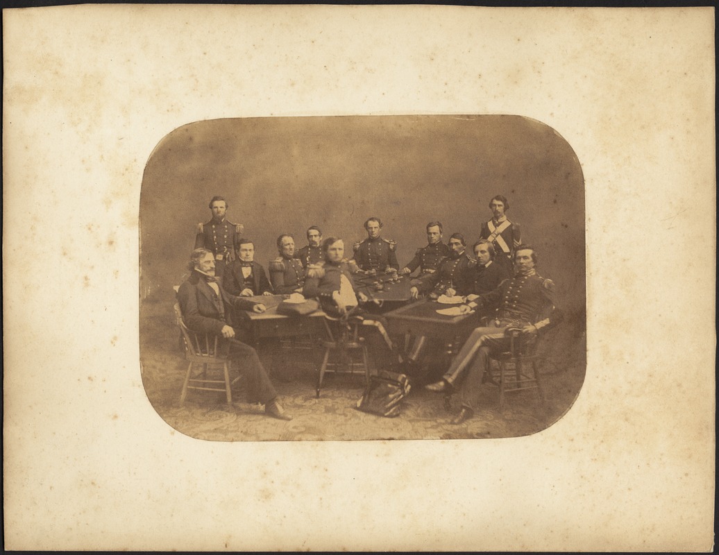 Group of men sitting at table