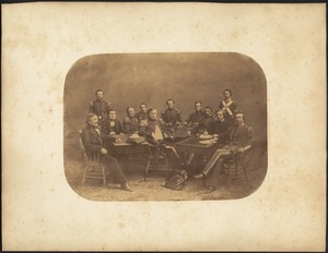 Group of men sitting at table