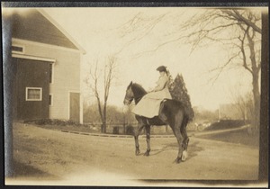 Ashdale Farm. Woman on horseback near barn, possibly Gertrude Stevens Kunhardt.