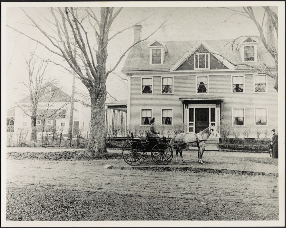 Ashdale Farm. Early photo of Gertrude Stevens in horse and buggy in front of main house; barn on left; woman standing near tree on far right.