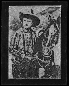 A man stands next to a horse