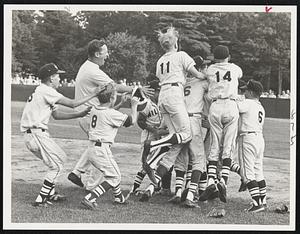 Many Mini-Stars-Arlington West pitcher Jack Repetto is swarmed under by his happy teammates Monday night after Spy Ponders defeated Smithfield, R.I., 3-2 in Little League N.E. title game.