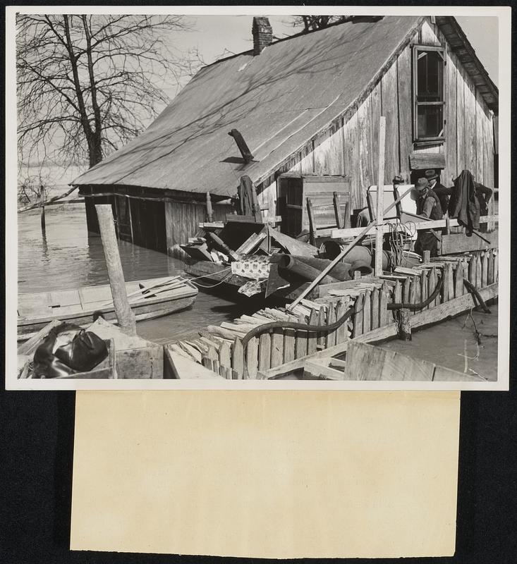 Arkansas Levee Weakens, Bringing Inundation William Greer removes household goods from his home near here, after the Mississippi levee has weakened and the flood waters have come. Soldiers are removing thousands from low-lying region in this state.