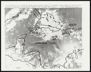 Miami, Fla-- Hurricane "Inez is shown over Cuba in this photo made by weather satellite "ESSA" at 8:00am EST 10/1.