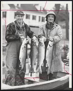 Fishing was Good - Severin and Louis Pouloit of Manchester, N. H., display four of 14 trout their party caught in Lake Sunapee, N. H., this week. The trout (at left) is an even 10 pounds and the other three 8 1/2 pounds apiece. Total weight of the 14 trout was 113 1/2 pounds.