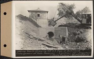 Contract No. 99, Enlargement of Fells High Level Distribution Reservoir, Stoneham, Malden, Melrose, looking north showing 60 inch cast iron pipe at gatehouse, enlargement of Fells Reservoir, Stoneham, Mass., Aug. 13, 1940