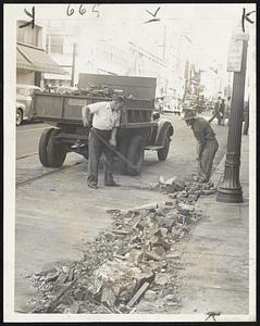 Chimney Sweeps - Not the kind that clean them out but the kind that clean them up. Scene is Purchase street, main thoroughfare of New Bedford, where hurricane toppled every fourth chimney or thereabouts and uprooted every third tree.