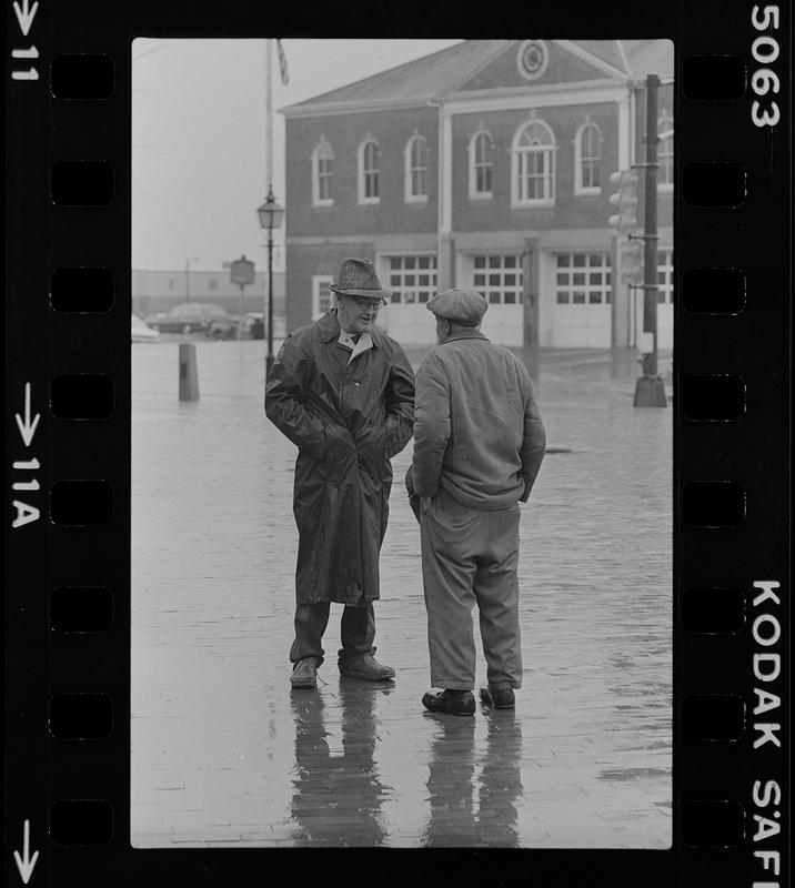 Two men in the rain