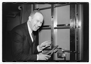 A man demonstrating how to break into a safe