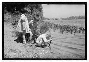 Children by a body of water