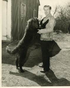 Jockey Bobby Permane greeted by dog Curly