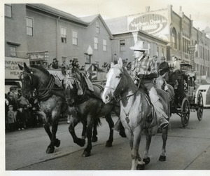 Cowboy with accompanying stagecoach at WWII victory parade