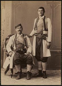 Studio portrait of two men in traditional Greek dress